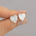 Brinco coração martelado